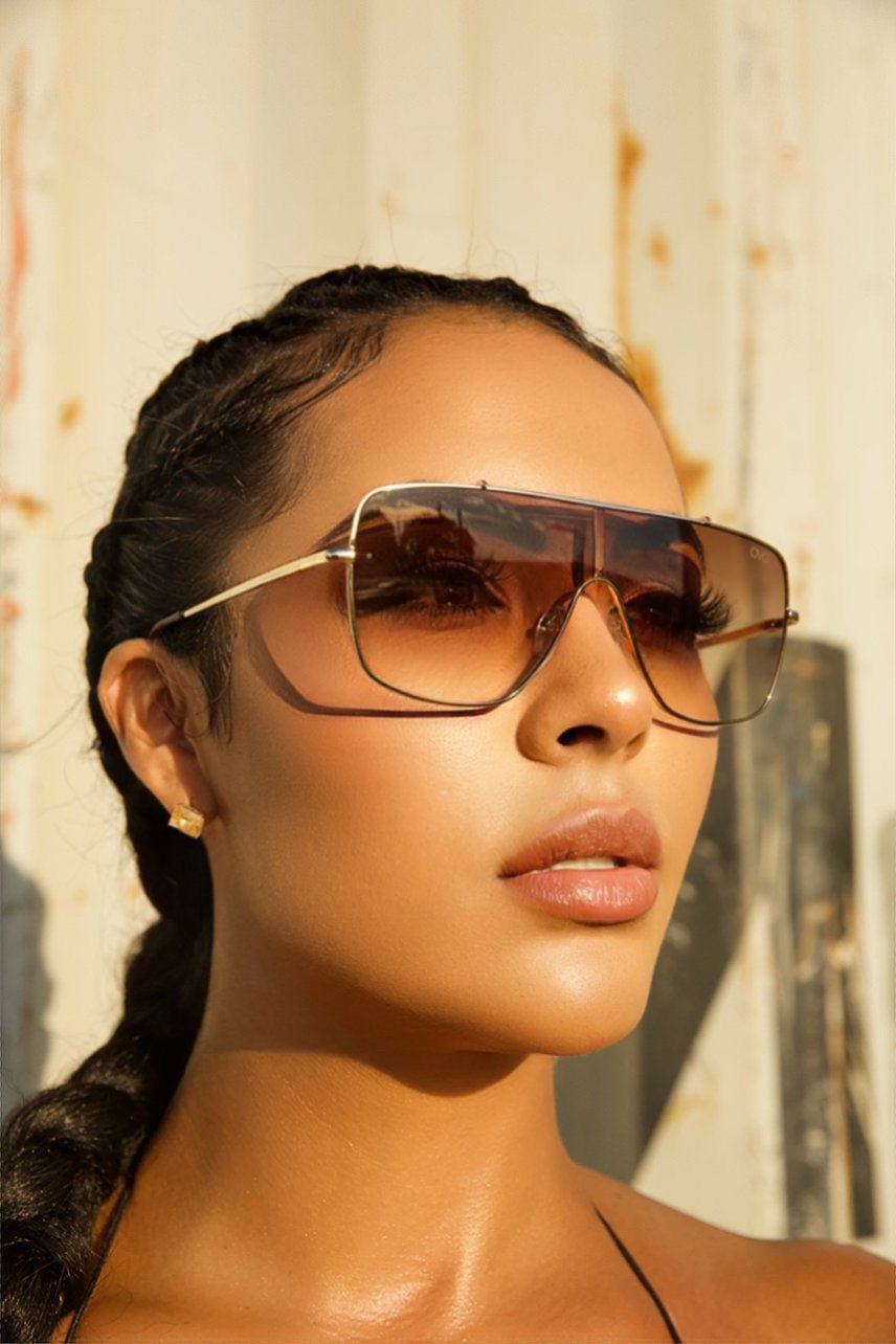 women wearing a brown shades- OMG Swim